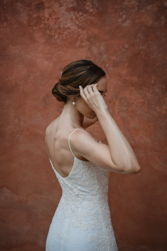 Close-up of the bride holding her bouquet with delicate flowers.