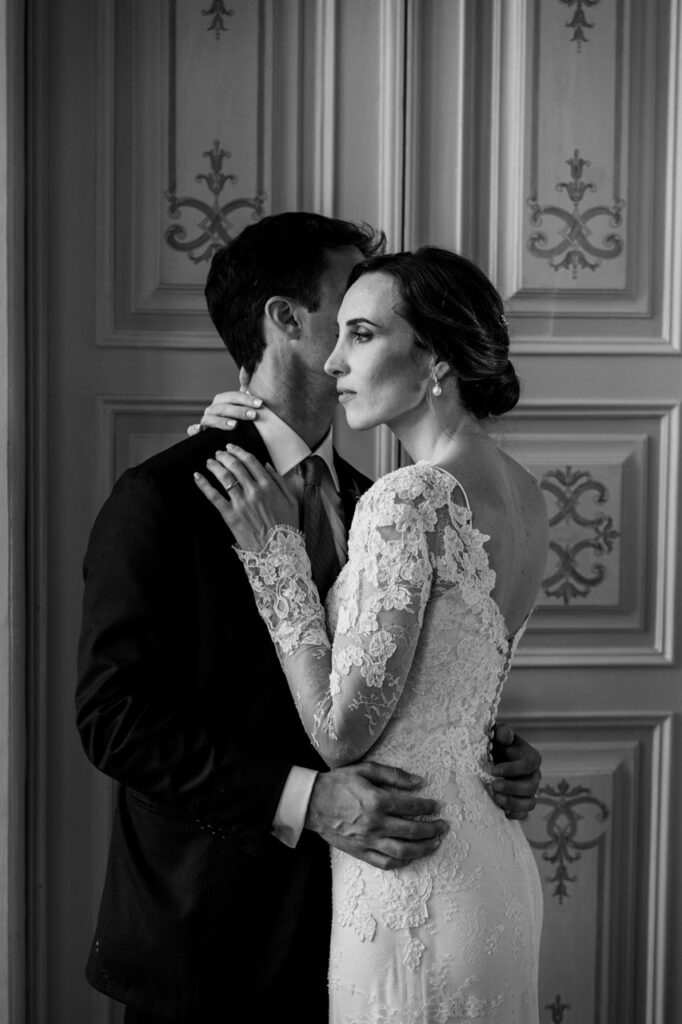 Couple walking away from the camera, hand in hand.