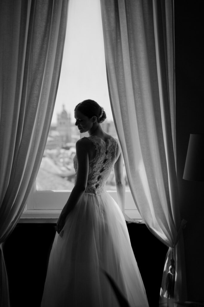 Groom waiting at the altar with a look of anticipation.