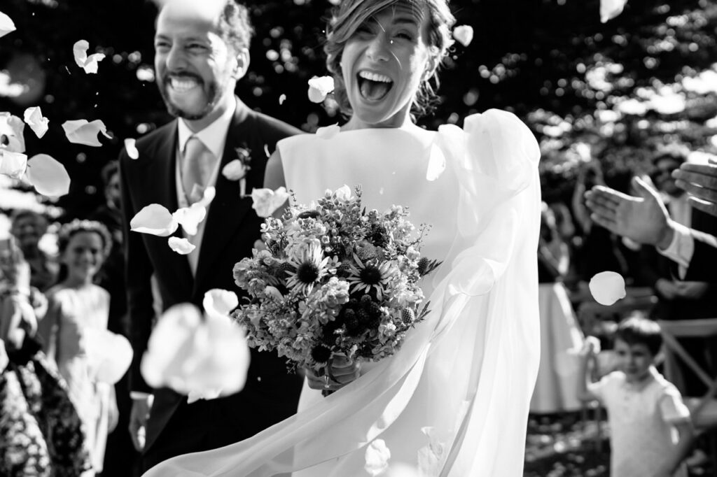 Bride and groom sharing a kiss on a boat