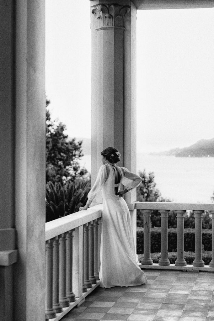 Bride and groom walking through a vineyard