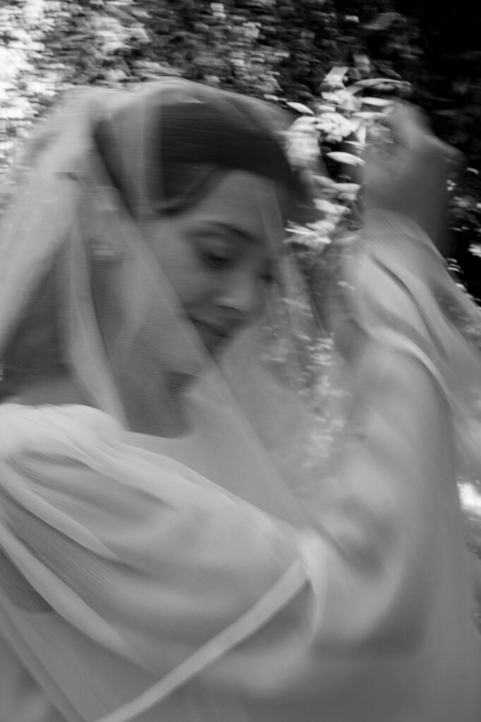 Bride and groom sharing a kiss in a garden